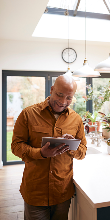 Person on tablet in kitchen